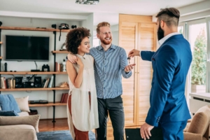 Real estate agent handing over the house key